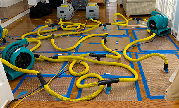 Professional Flood Damage Restoration technician working in Okmulgee, OK